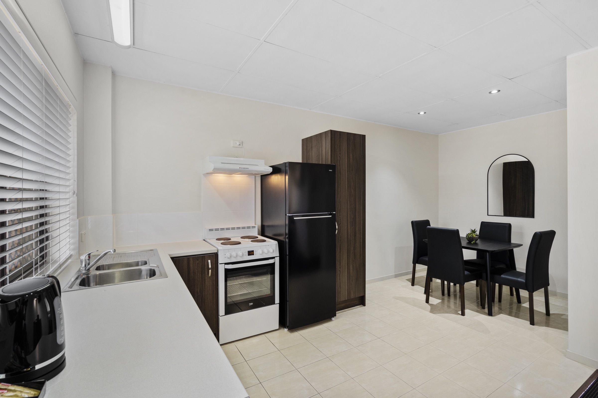 A self-contained villa's full kitchen and dining area